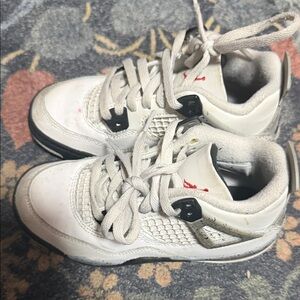 Jordan 4’s White cement and Black Sneakers